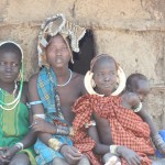 family in front off hut